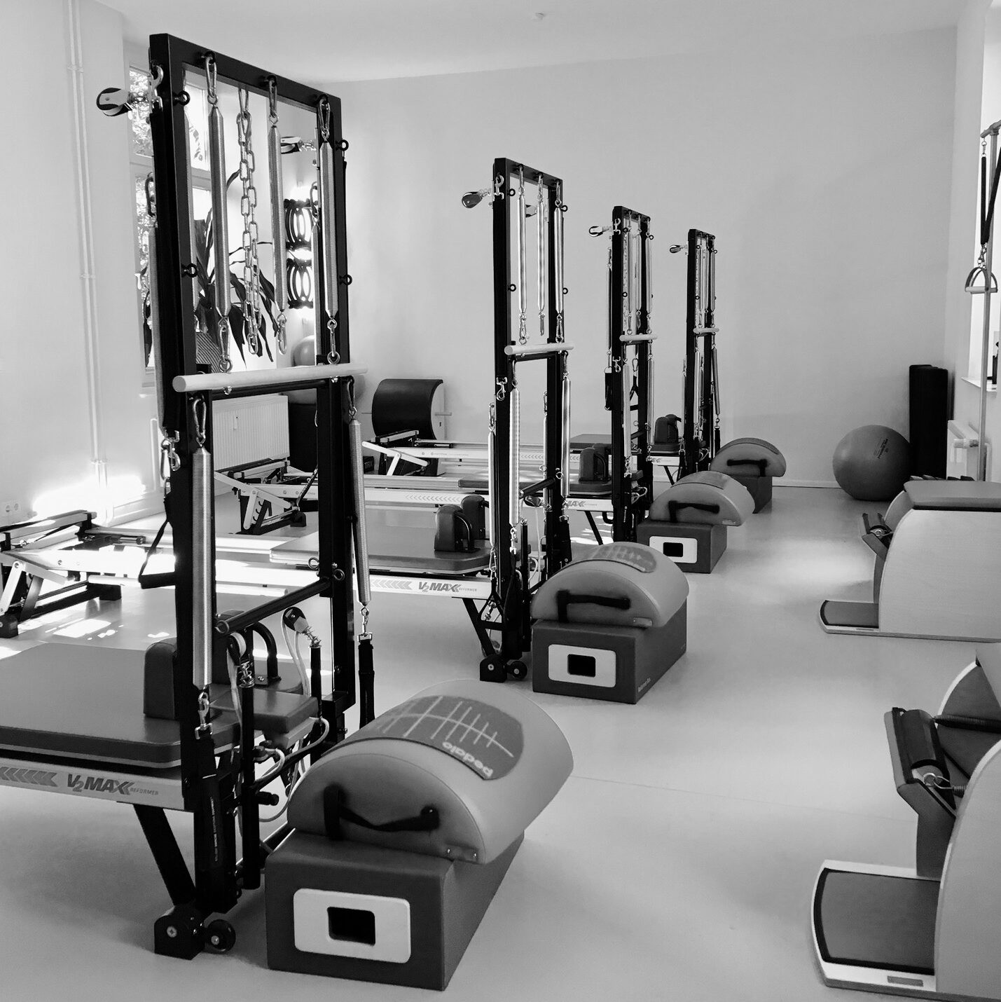 Pilates equipment studio equipped with Pilates Tower Unit Wall, Pilates Reformer, Pilates Chair equipment