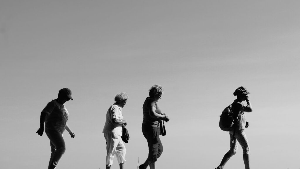 A group of older women who walk and move together. Health for the body.