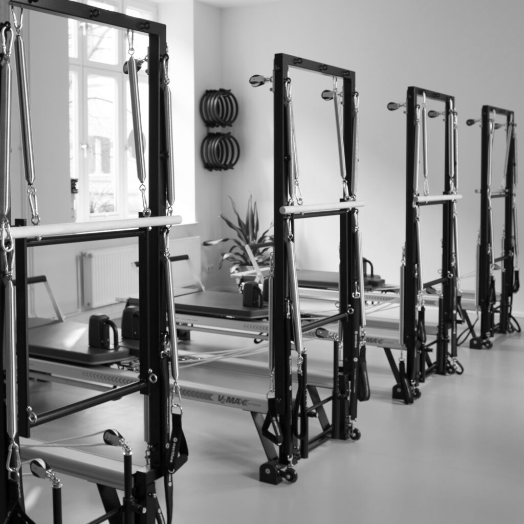 Pilates Tower Wall Unit in a modern Pilates studio in Berlin Mitte. Merrithew-Pilates-Equipment.